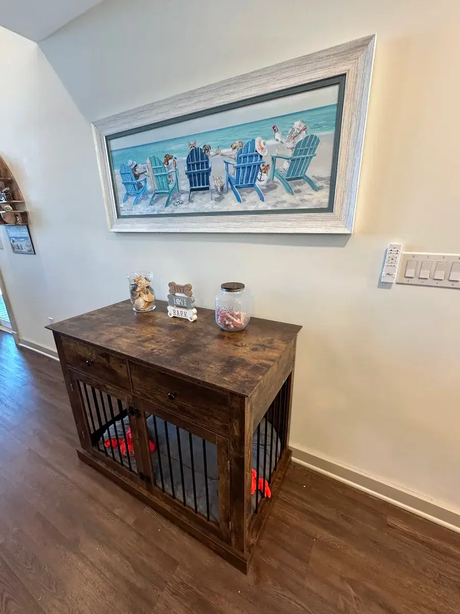 Dog kennel furniture with treats and Live Love Bark décor at Grandy Cove