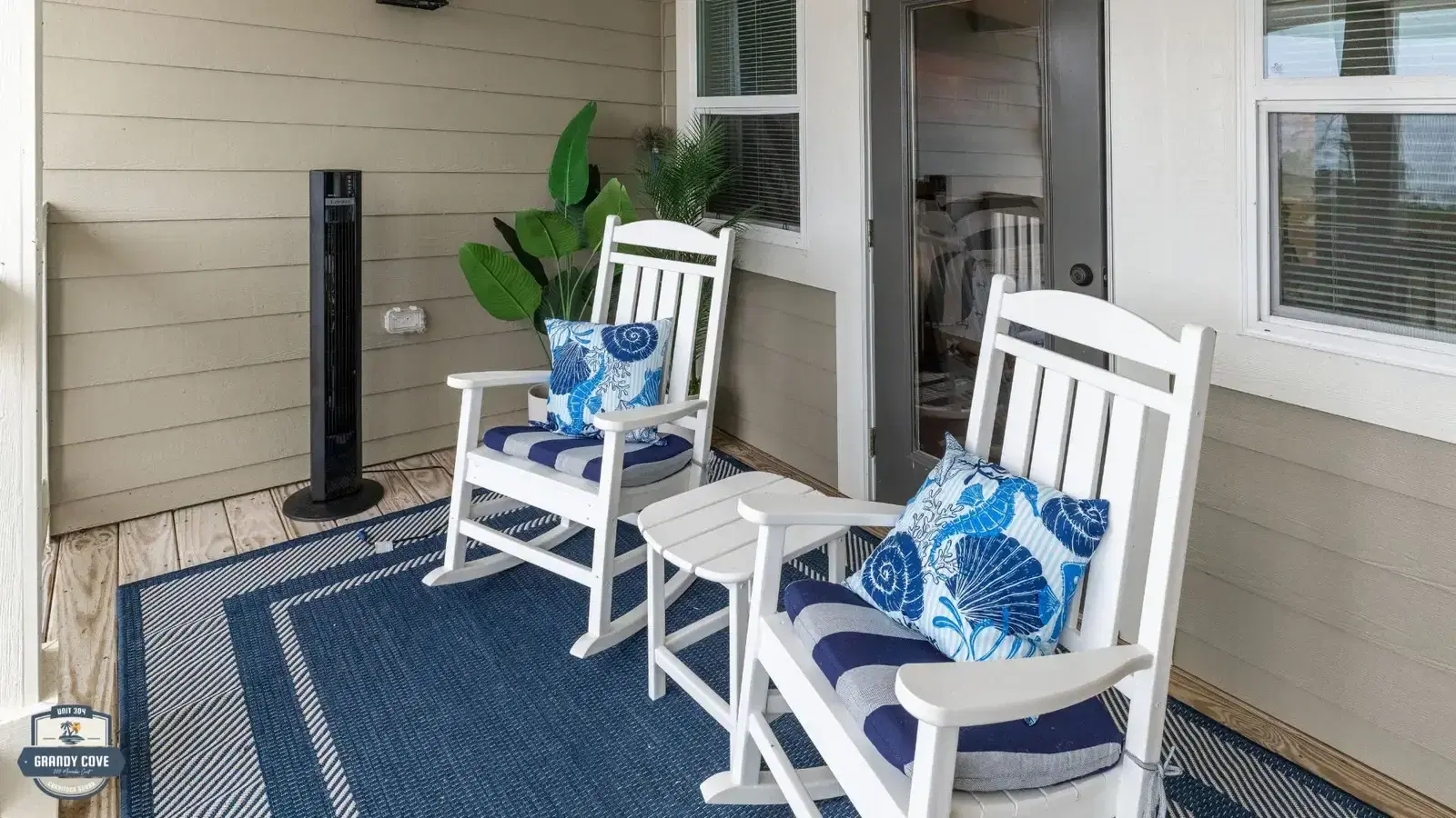Grandy Cove balcony with rocking chairs and water view