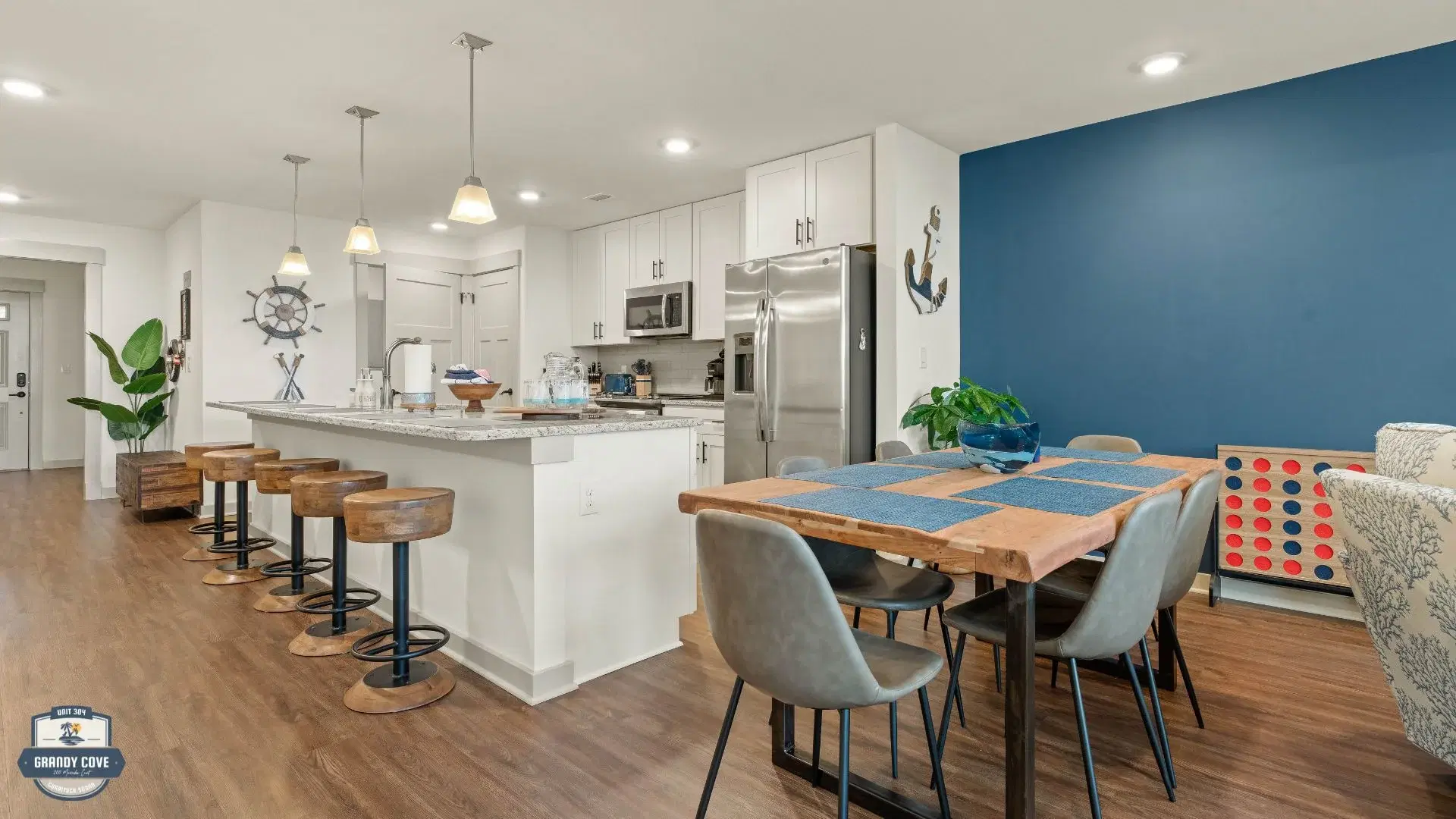 Grandy Cove open-plan dining and kitchen with wood table